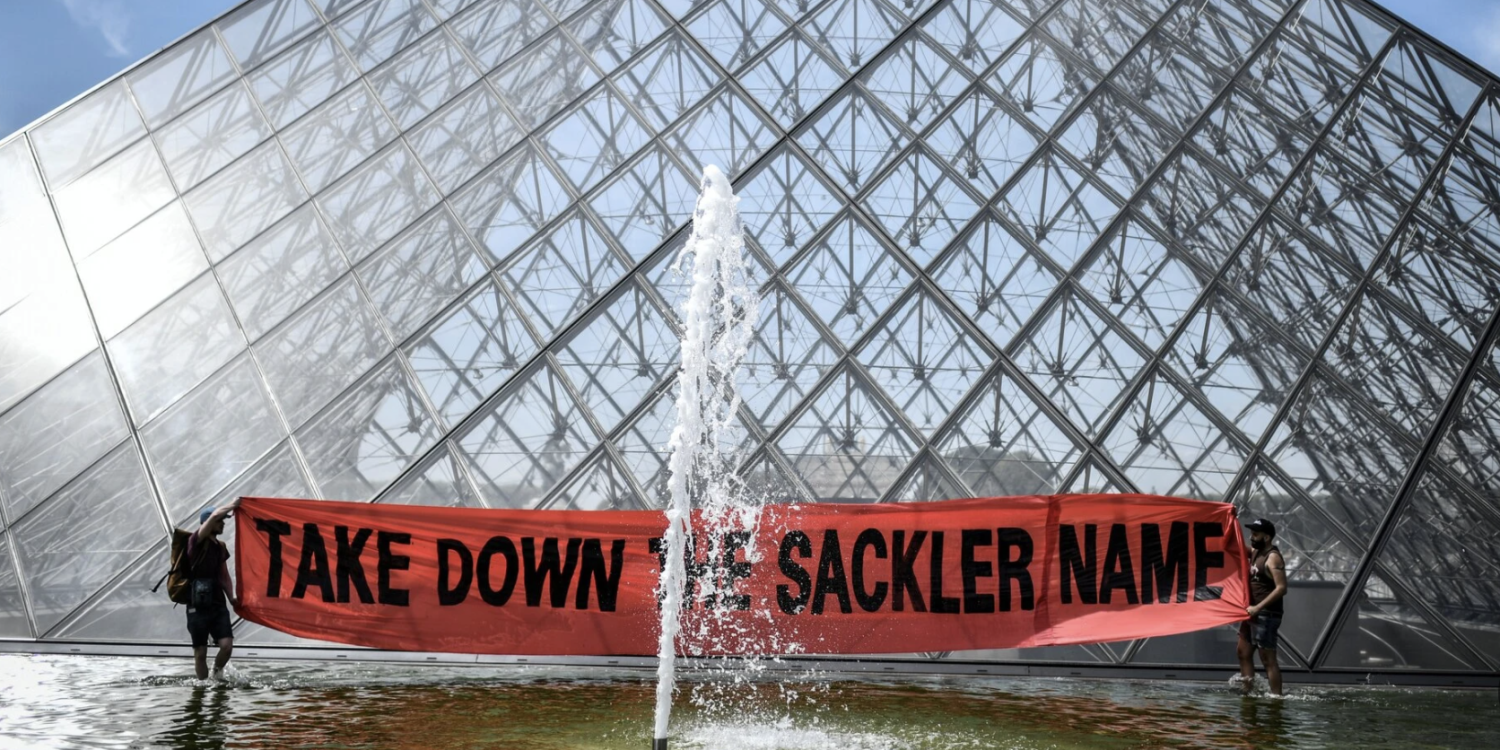 A 2019 protest in front of the Pyramid of the Louvre in Paris, opposing the museum’s ties to the Sackler family. The demonstration was organized by the activist group P.A.I.N., or Prescription Addiction Intervention Now, which was founded by Nan Goldin.Credit...Stephane De Sakutin/AFP via Getty Images