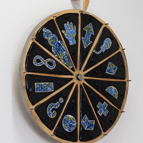 Wheel of Answers For the World, 2024, glazed ceramic, wood, steel, magnets, ball bearing, spring, 30 H x 24 W x 4 D inches