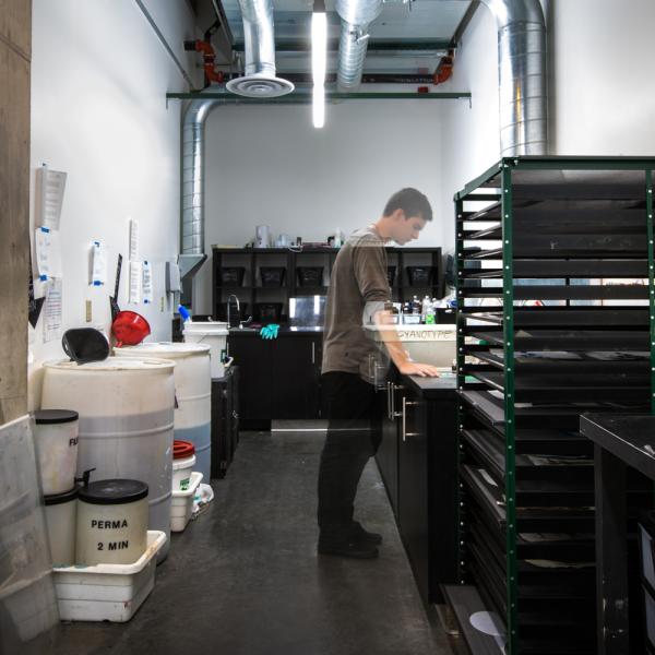 student in darkroom