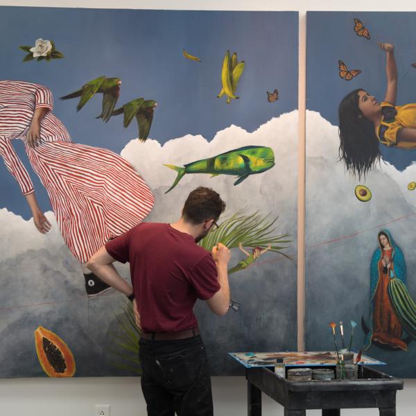 Drawing & painting student and BFA candidate, Gabriel Sanchez, applying finishing touches to his BFA exhibition paintings.