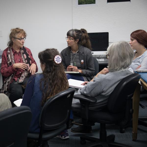Students receiving instruction from professor Melanie Walker