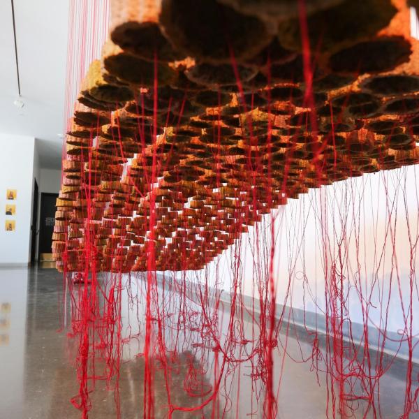 "Hopium," 2021. Paper, food coloring, crochet thread, fabric. 8’x15’x4'.