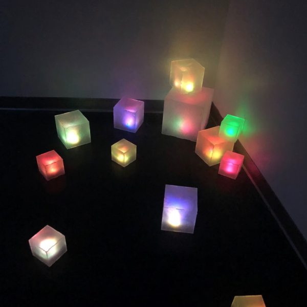 Hailey Carlson. "Digital Spill," Self-lit acrylic voxels. 4", 6", and 10" cubes. 2019