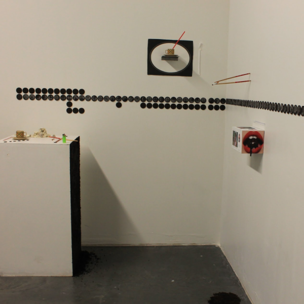 Molly Ott. "If the cookie breaks when I tear it apart I can eat it," Oreos, chopsticks, collage, cigarettes, ceramic cups, plastic straws. 6'x14'x2'. 2019