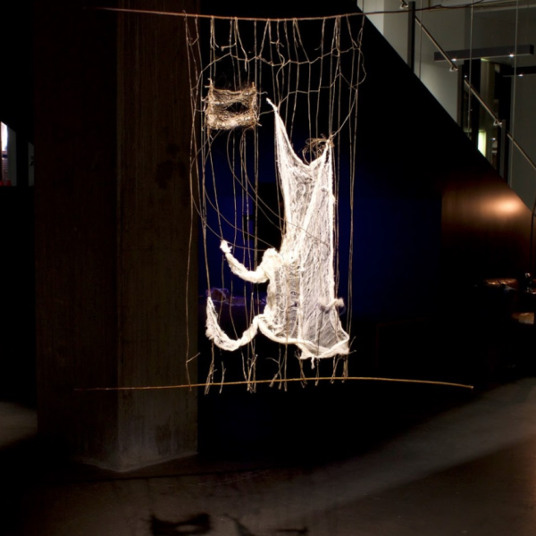 Samara Johnson. "Learning to Leave," Synthetic sinew, cheesecloth, willows, horse hair. 22"36"1". 2019
