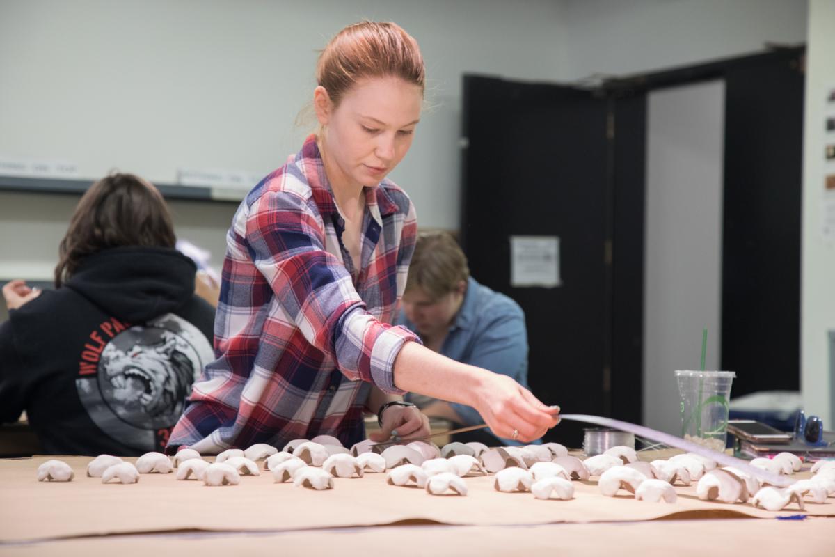student with artwork