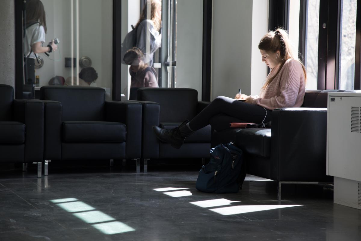 student working in the Art Department's atrium
