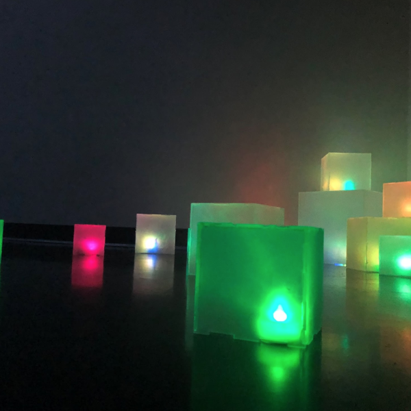Hailey Carlson. "Digital Spill,"	Self-lit acrylic voxels. 4", 6", and 10" cubes. 2019