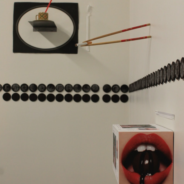 Molly Ott. "If the cookie breaks when I tear it apart I can eat it," Oreos, chopsticks, collage, cigarettes, ceramic cups, plastic straws. 6'x14'x2'. 2019