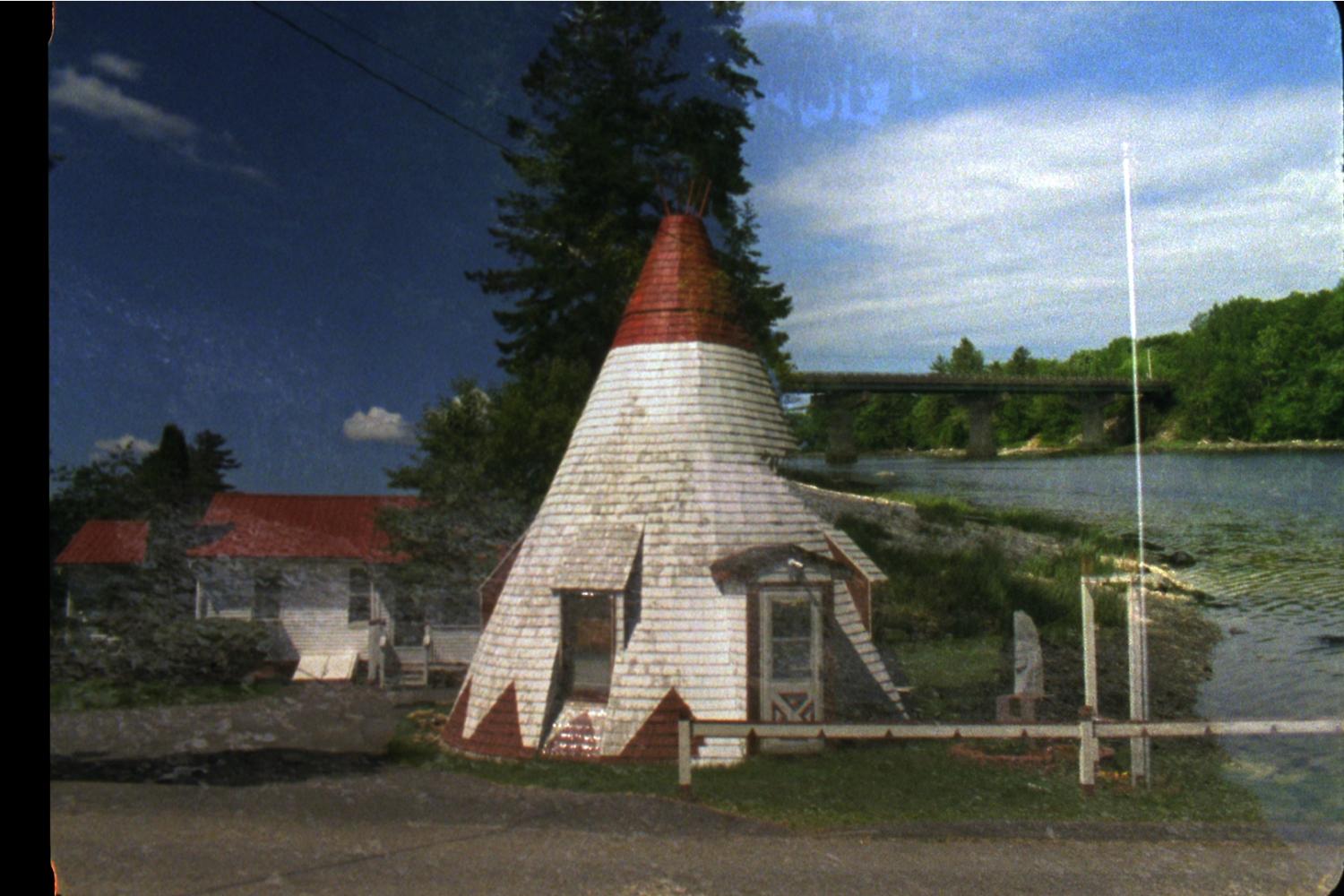 Film still with teepee house