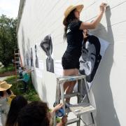 Jasmine Baetz installing artwork