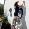Jasmine Baetz installing artwork