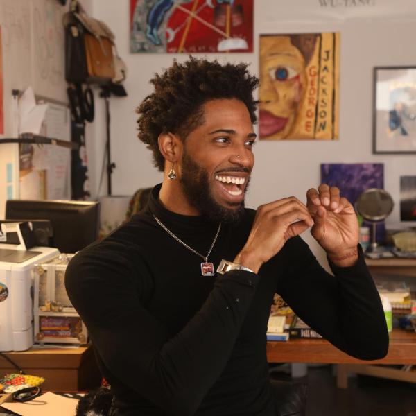 An excited student in an art lab