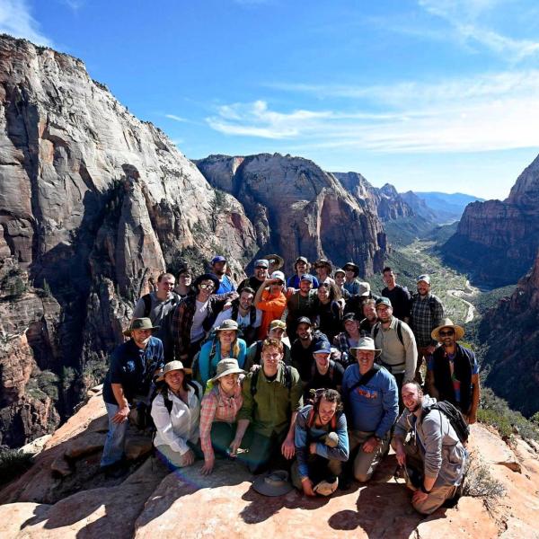 students on a trip at Canyonlands gather in a groups for a photo.