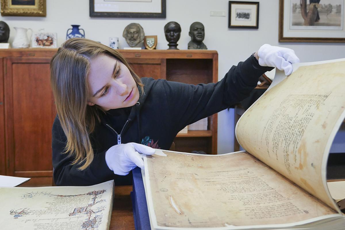 student looking at a history book