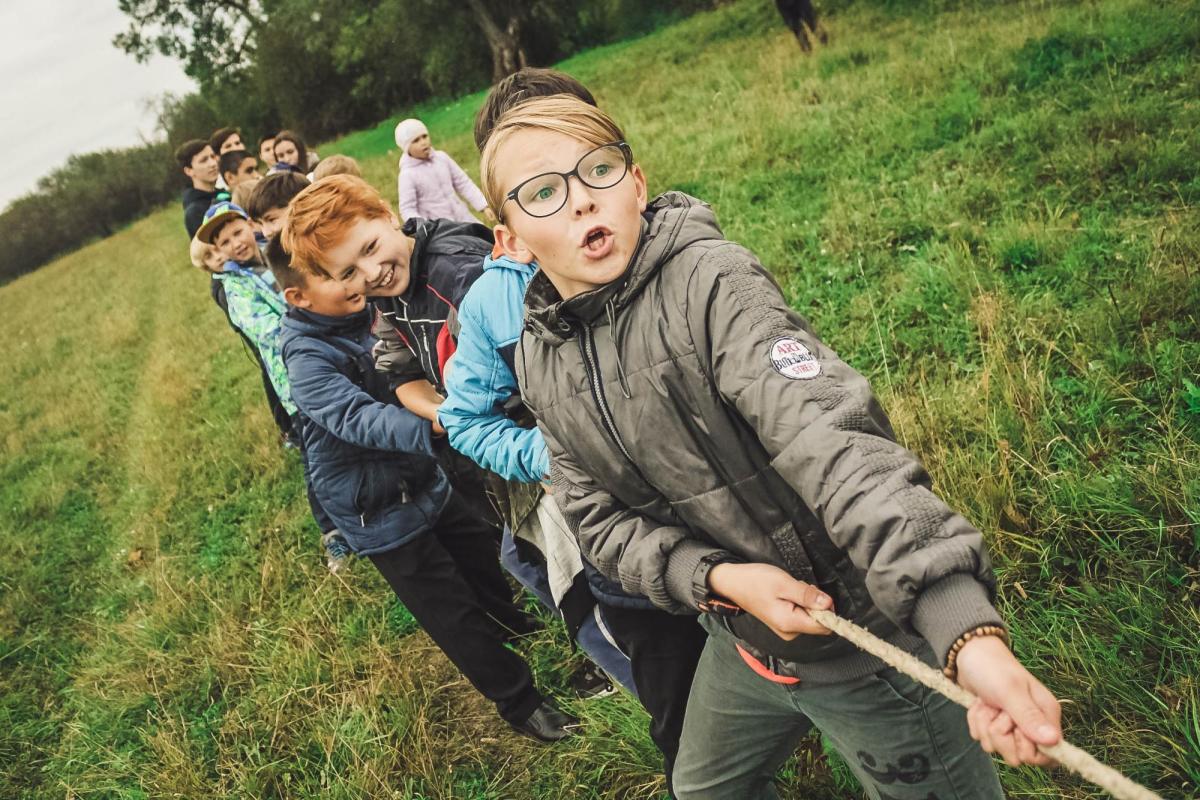 Image of kids playing tug-a-war. Photo taken by Anna Samoylova.