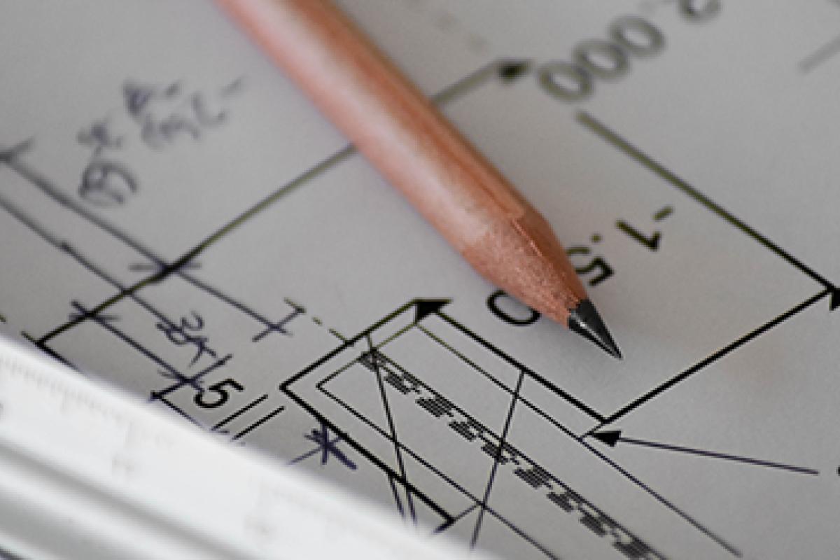 A pencil sits on a long equation.