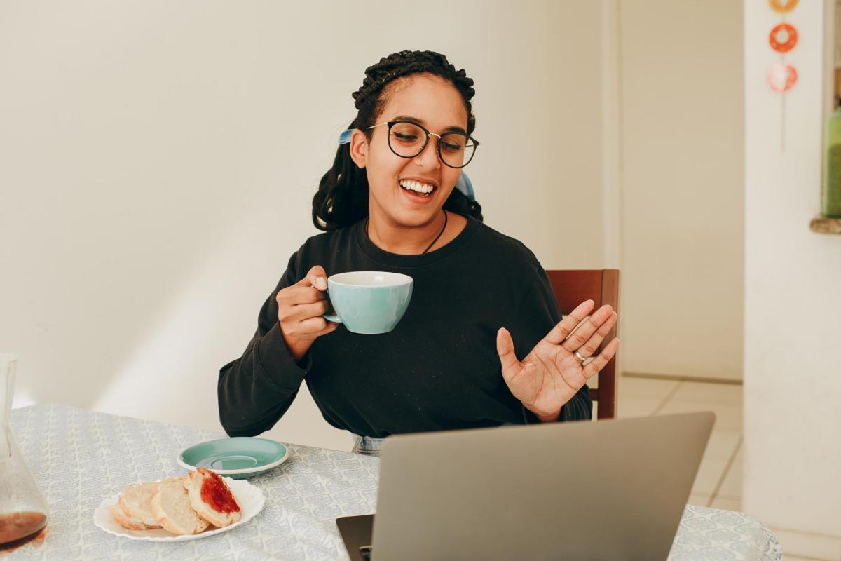 woman working from home; talking to computer