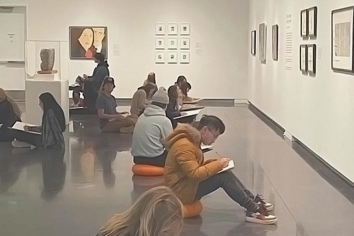Students within an exhibit at the CU Art Museum