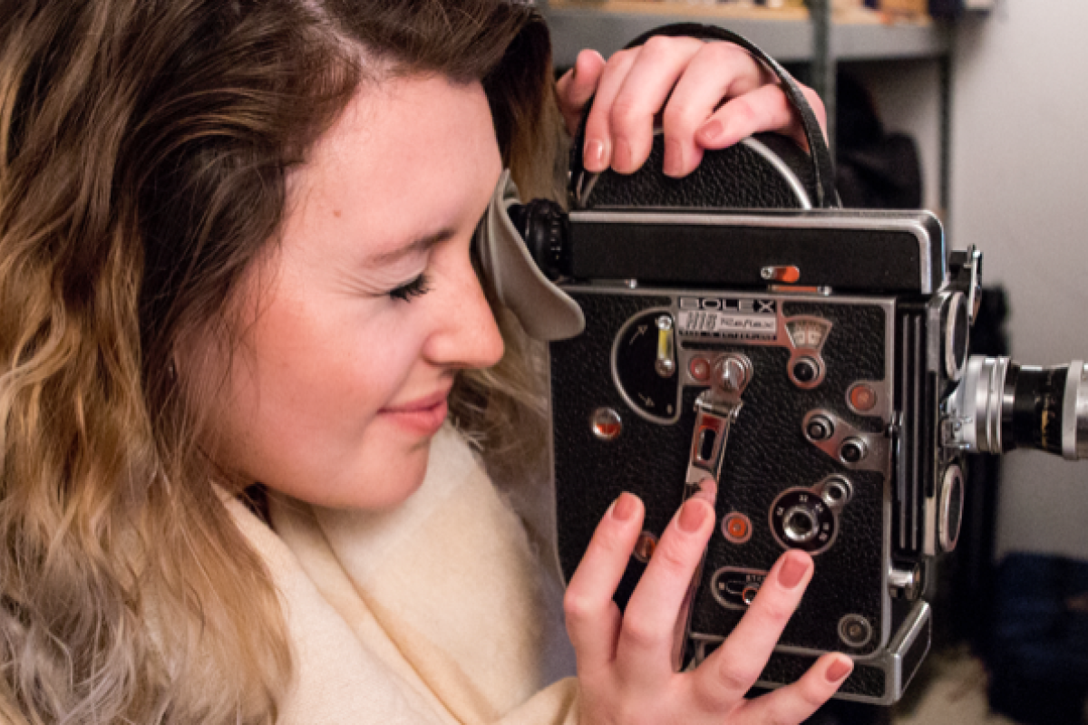Student playing with a camera