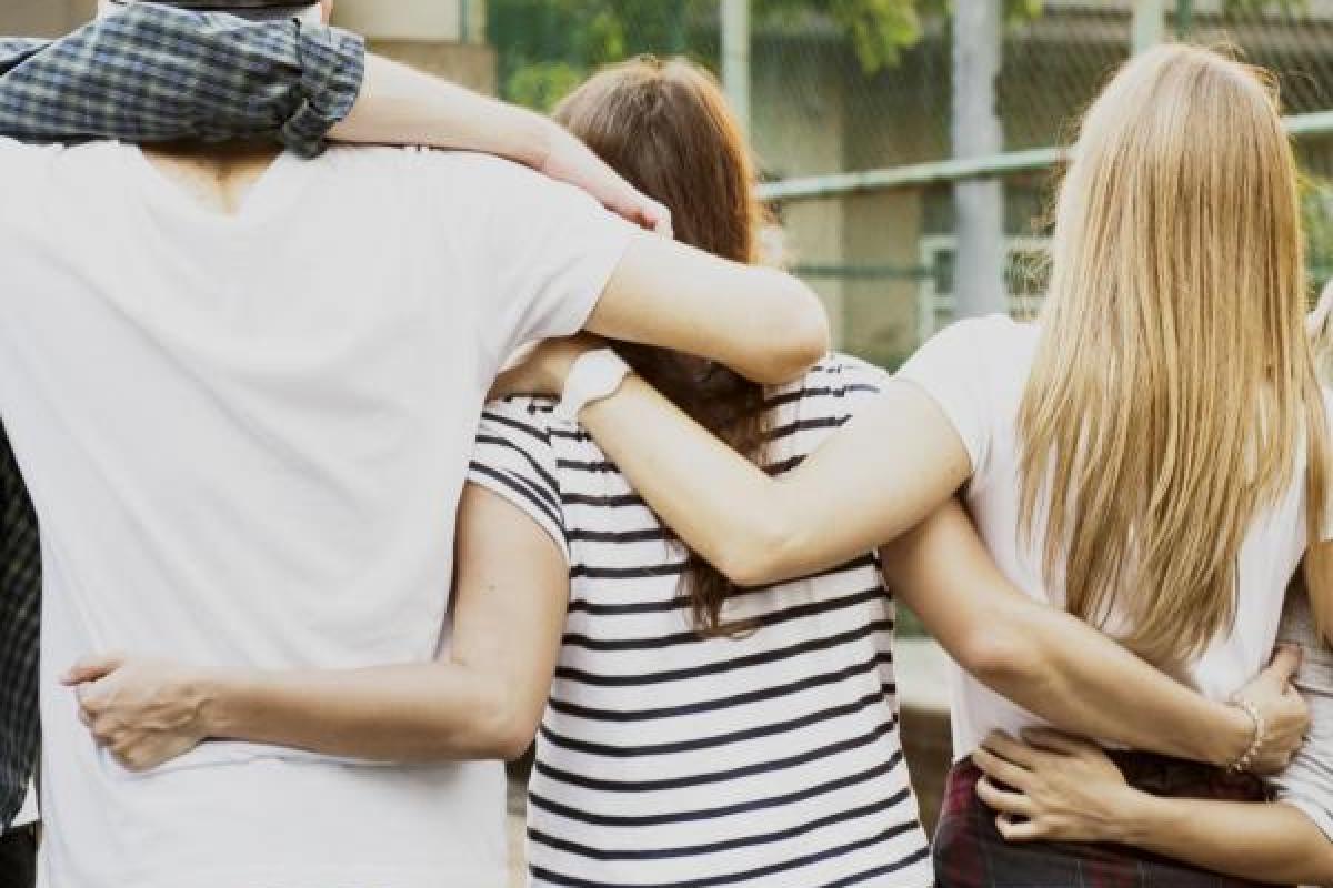 People with linked arms