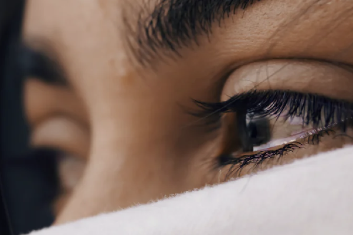 Image of a woman with a tear in her eye