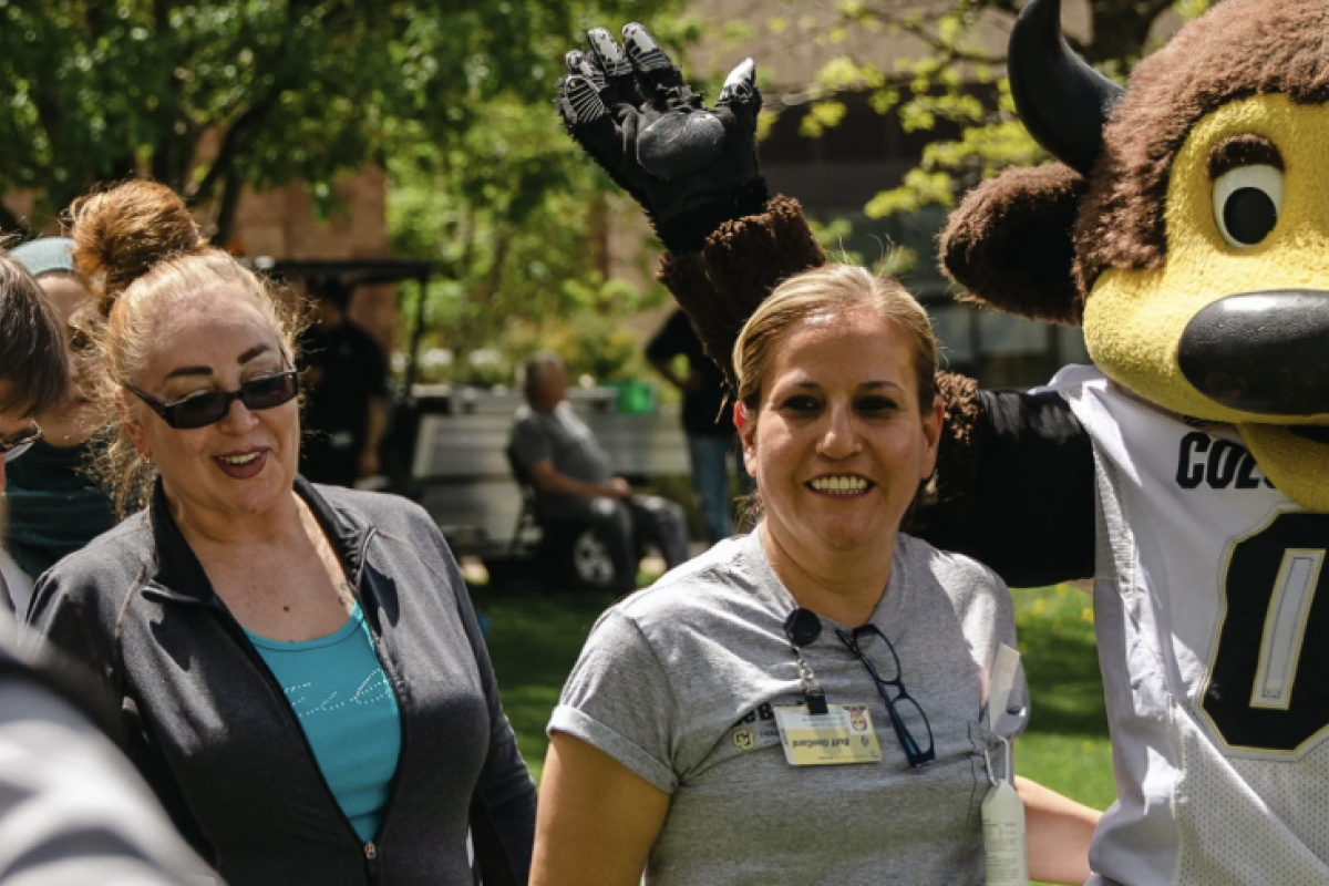 Photo of staff with Ralphie