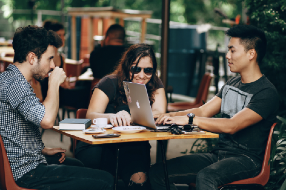 Students sitting at a table laughing
