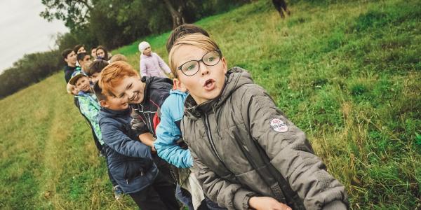 Image of kids playing tug-a-war. Photo taken by Anna Samoylova.