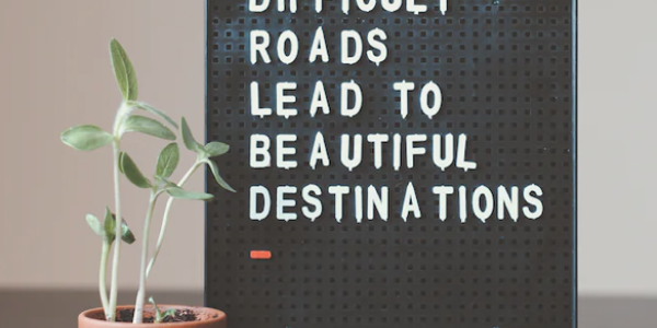 Motivational sign: Difficult roads lead to beautiful destinations