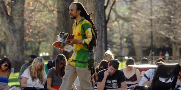 A professor teaching a class outside.