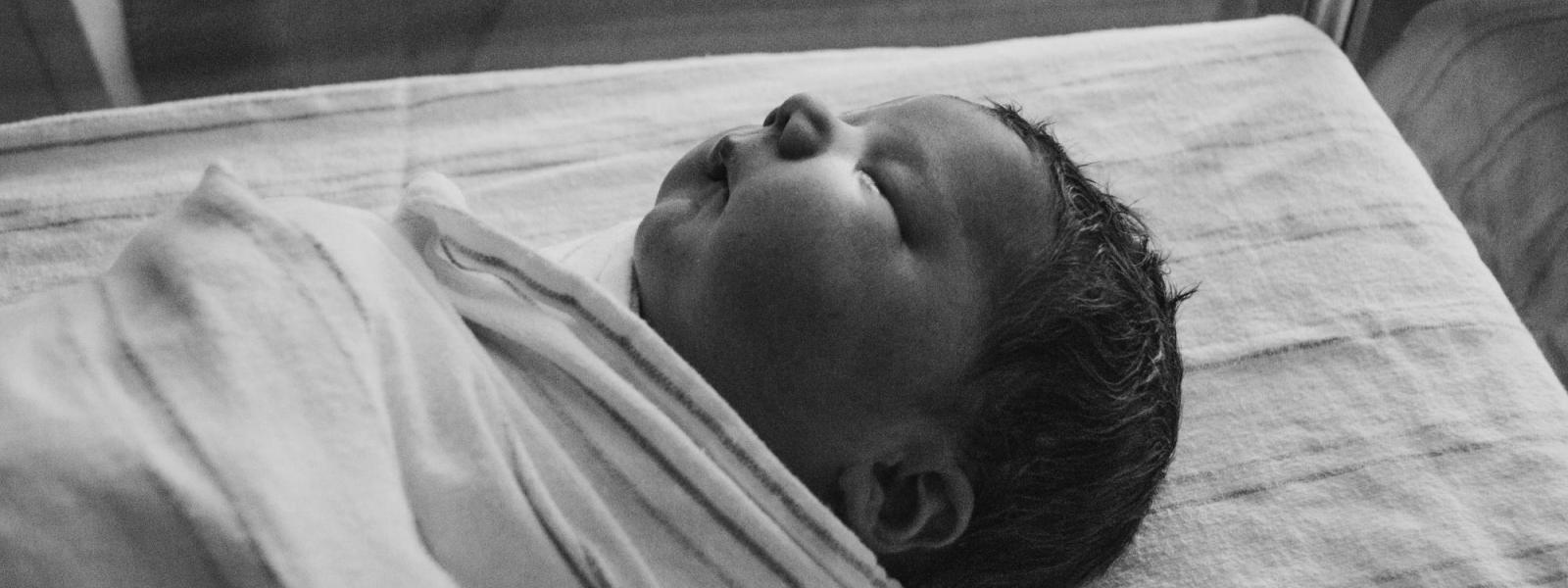 Stock photo of swaddled baby