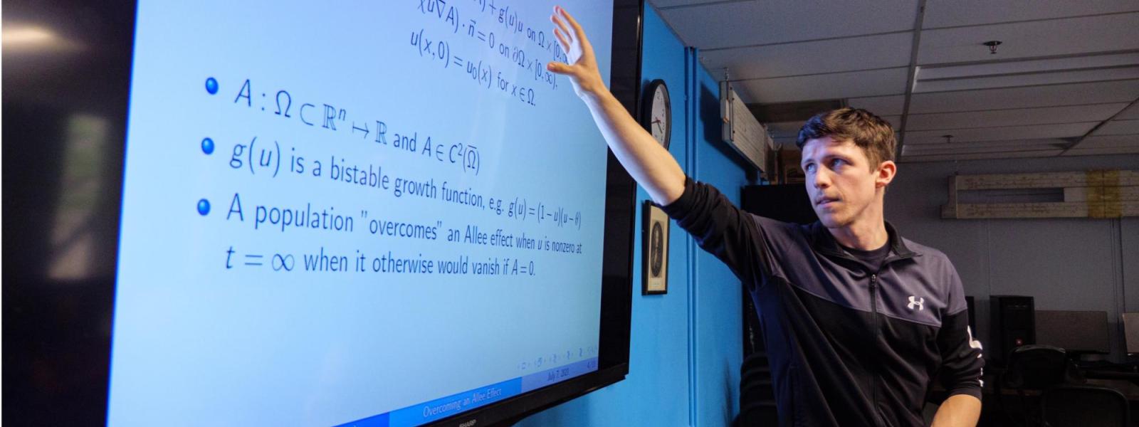 A professor discusses a math solution