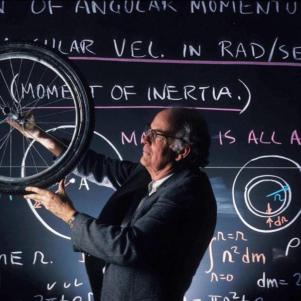 physics faculty spins bicycle wheel