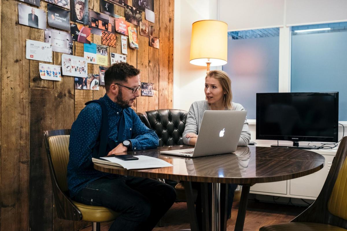 student and faculty discussion in office