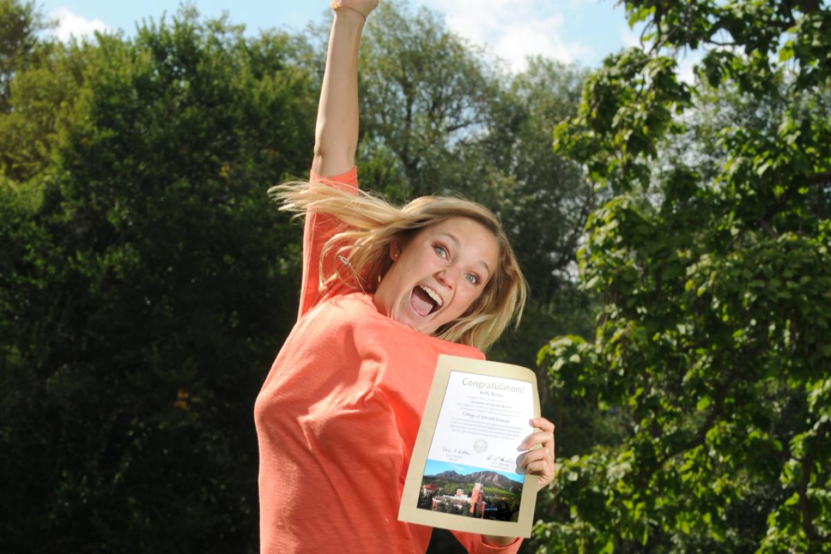 Student jumping with excitement