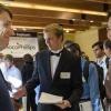 A well-dressed student chats with a HR representative from a local Boulder company