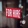 For hire is written on what appears to be a road sign.