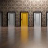 A series of similar doors with one yellow door.