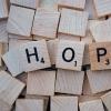HOPE spelled with Scrabble tiles