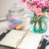 planner on a desk with flowers and chalk