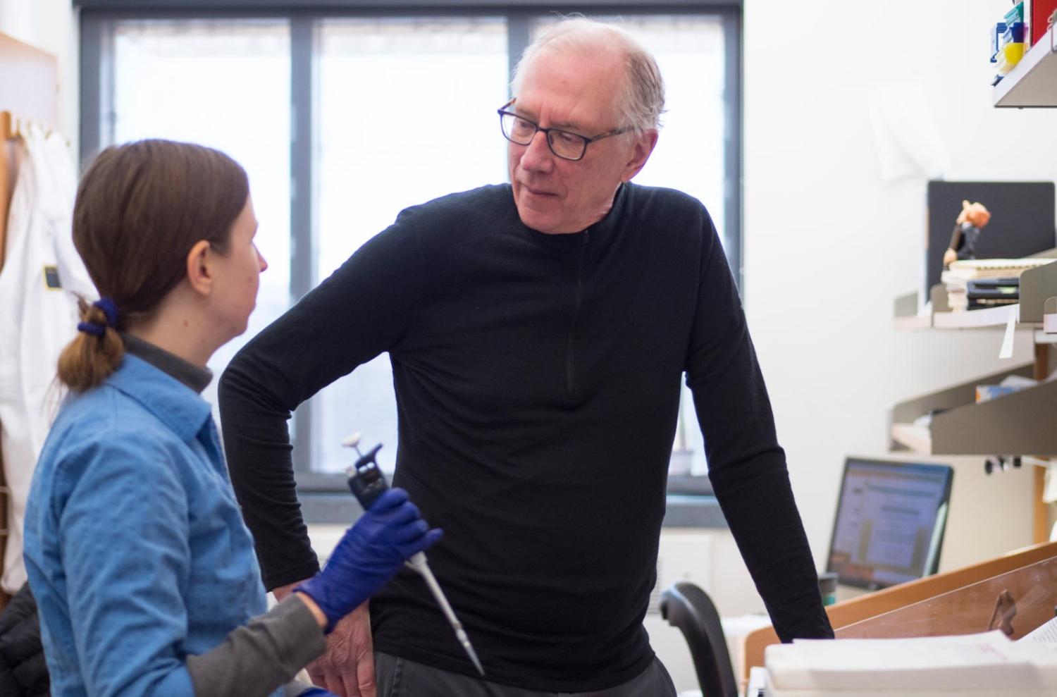 Thomas Cech with student in lab
