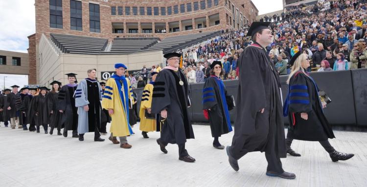 Faculty members in academic robes at graduation