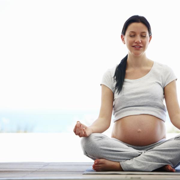 Practicing yoga during pregnancy can help prevent postpartum depression. iStockphoto.