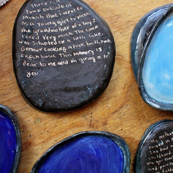 Ceramic plates with stories inscribed on bottom
