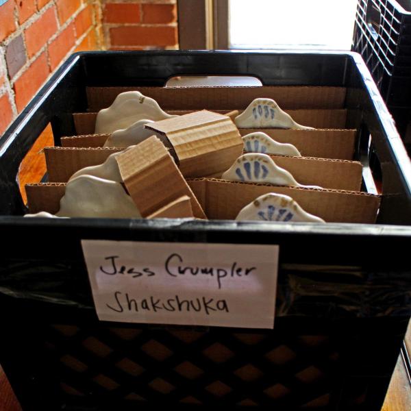 Shakshuka plates packed in crate for transport