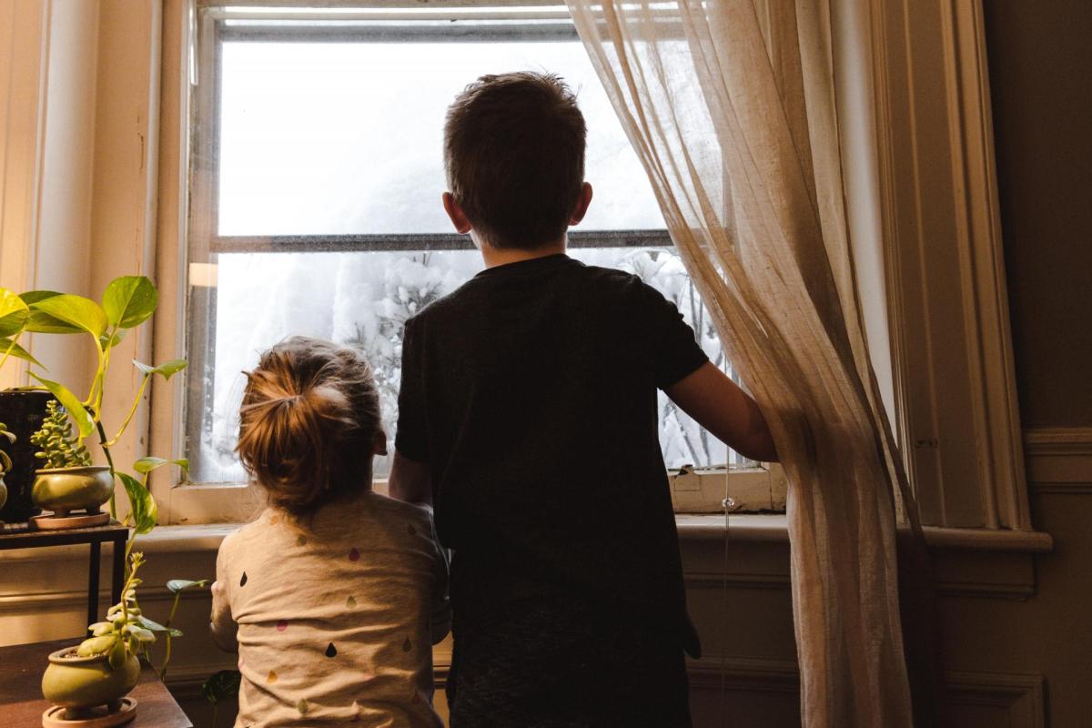 Kids looking out a window