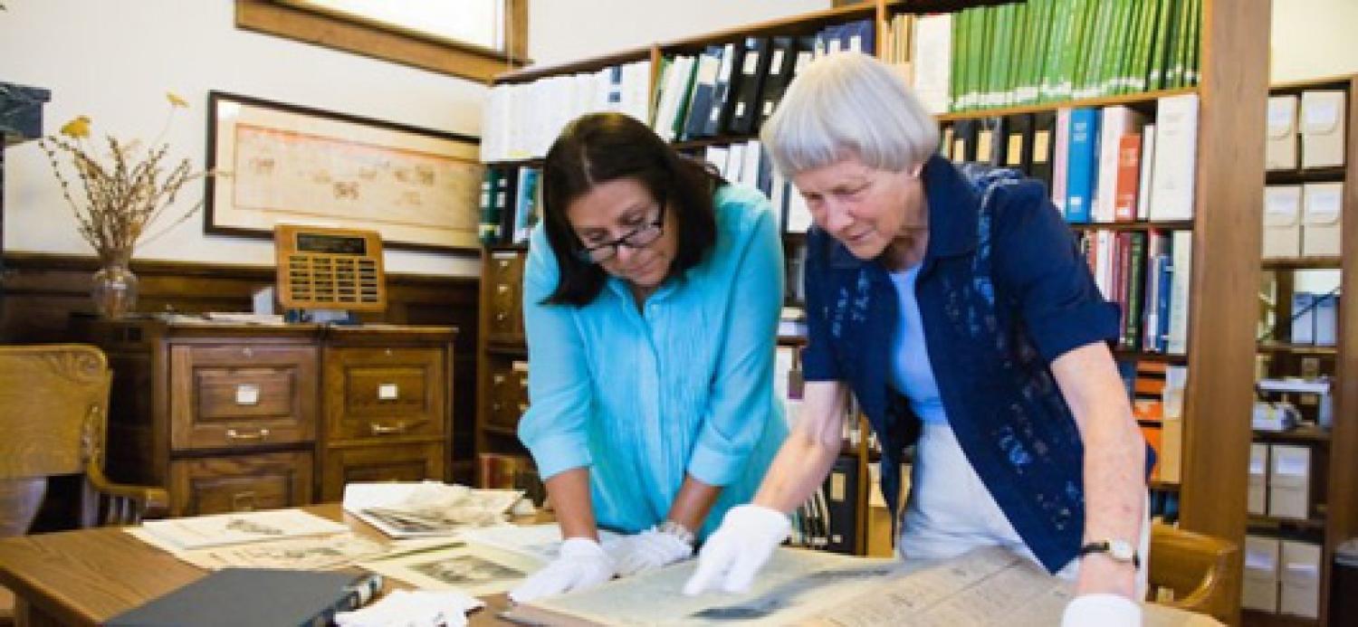 Marjorie McIntosh working with books