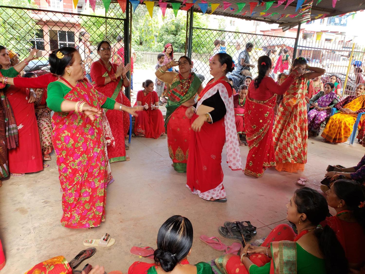 Single women wearing red and celebrating the Teej holiday in Nuwakot.