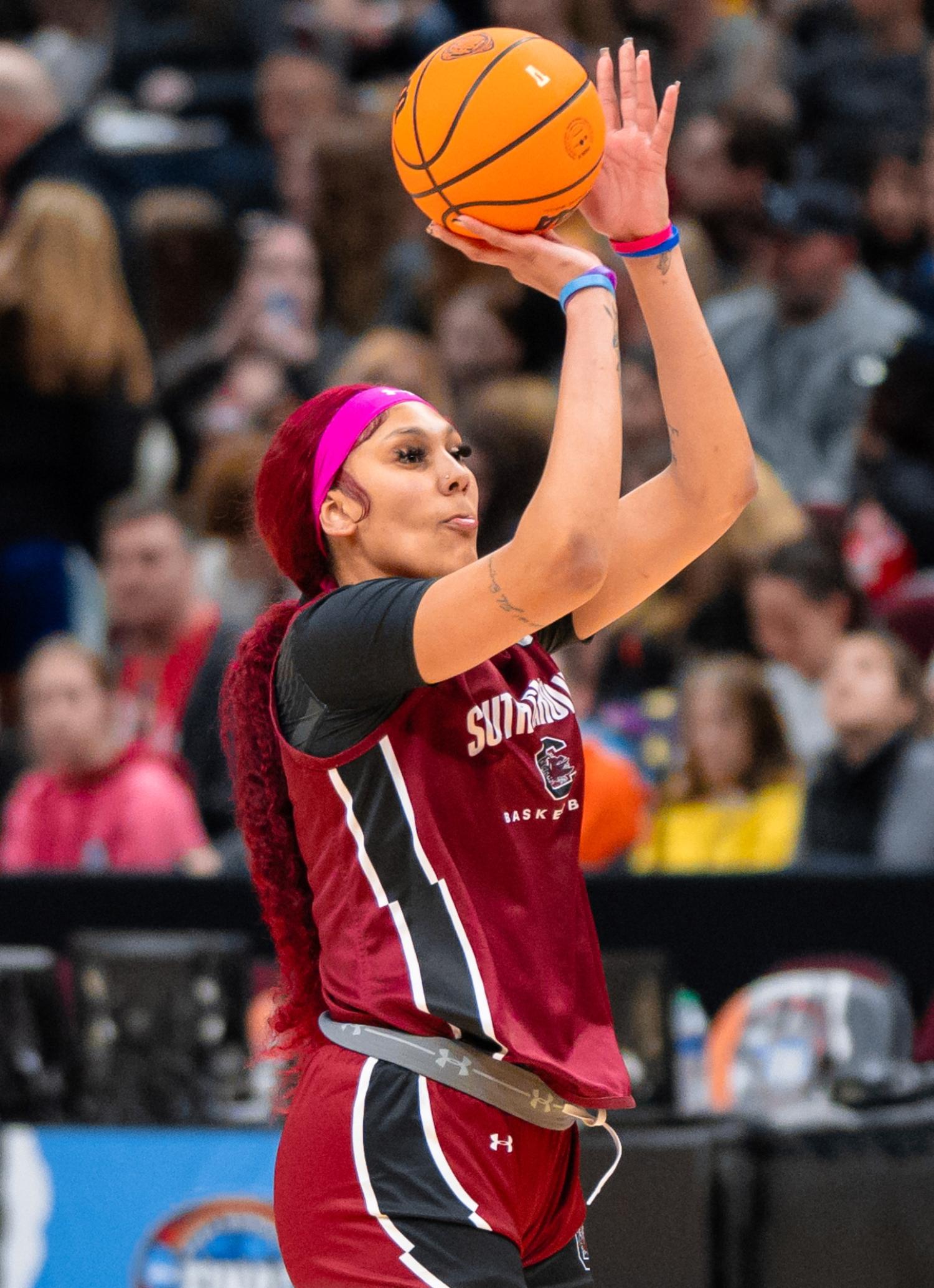 Kamilla Cardoso shooting a basketball